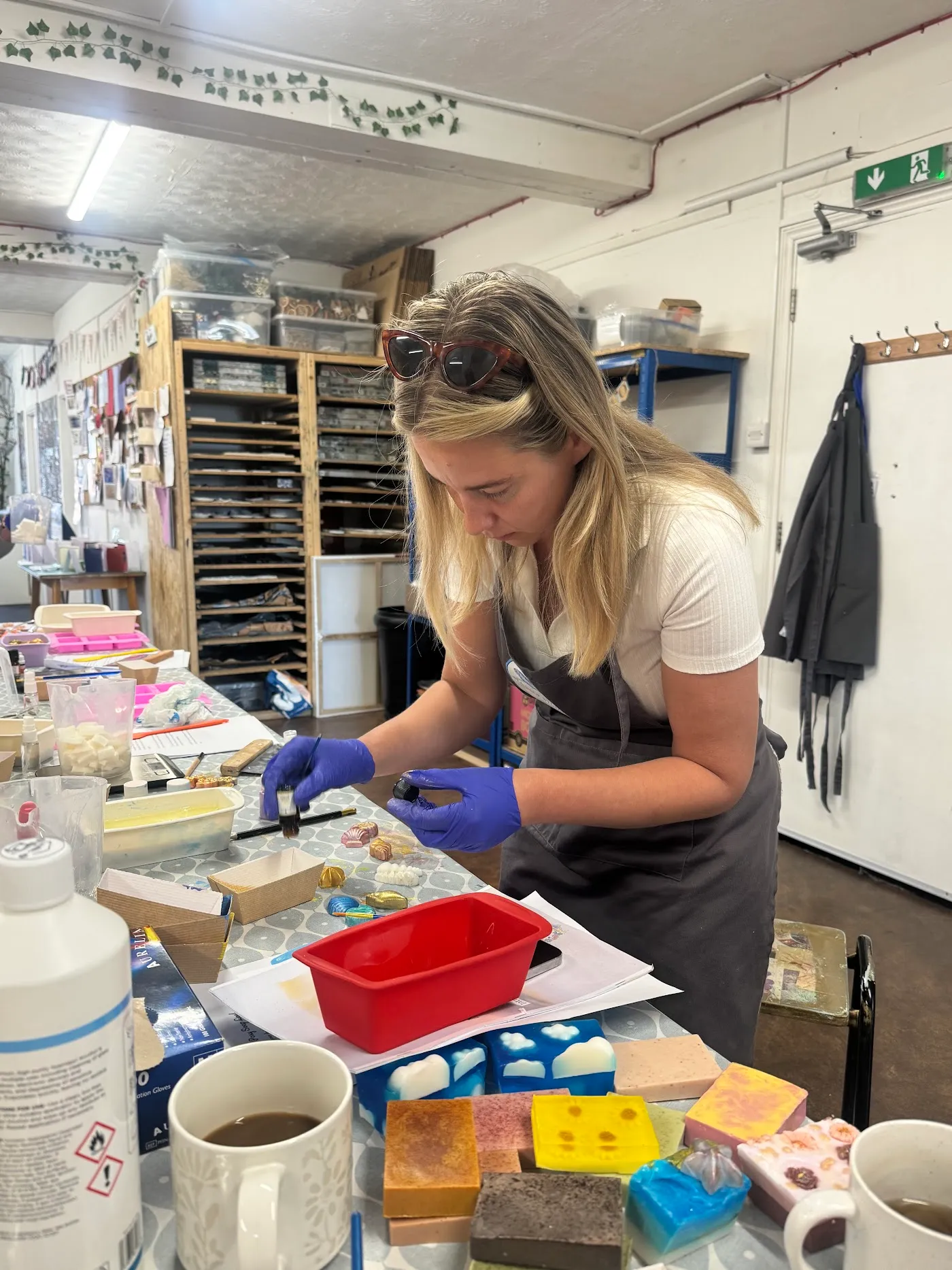 A guest pouring soap at a Little Bee workshop